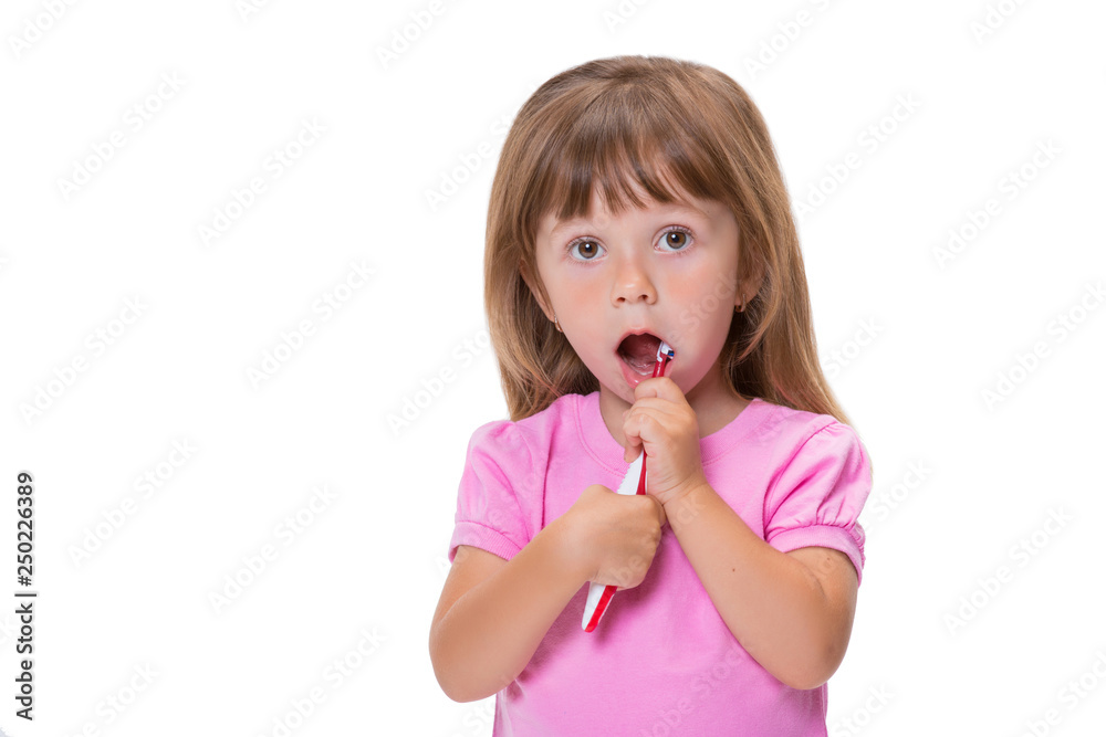 Close-up portrait Cute little girl 3 year old in pink t-shirt brushing her teeth isolated on white background Close-up portrait Cute little girl 3 year old in pink t-shirt brushing her teeth isolated on white background
