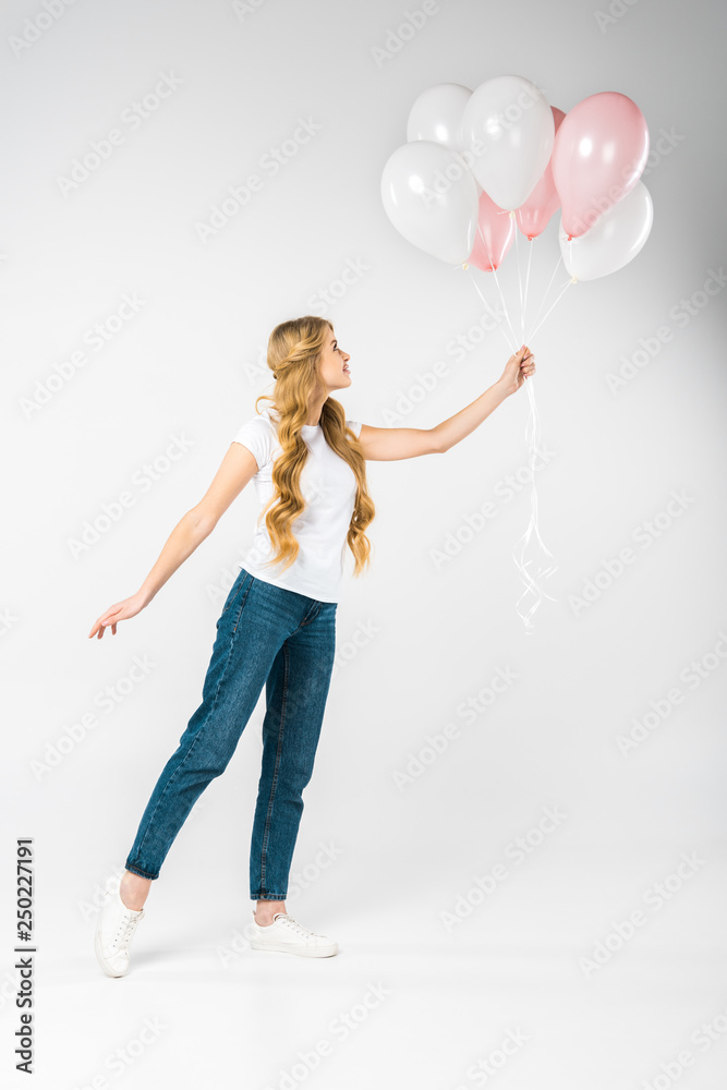 beautiful woman with festive pink and white air balloons on white background beautiful woman with festive pink and white air balloons on white background
