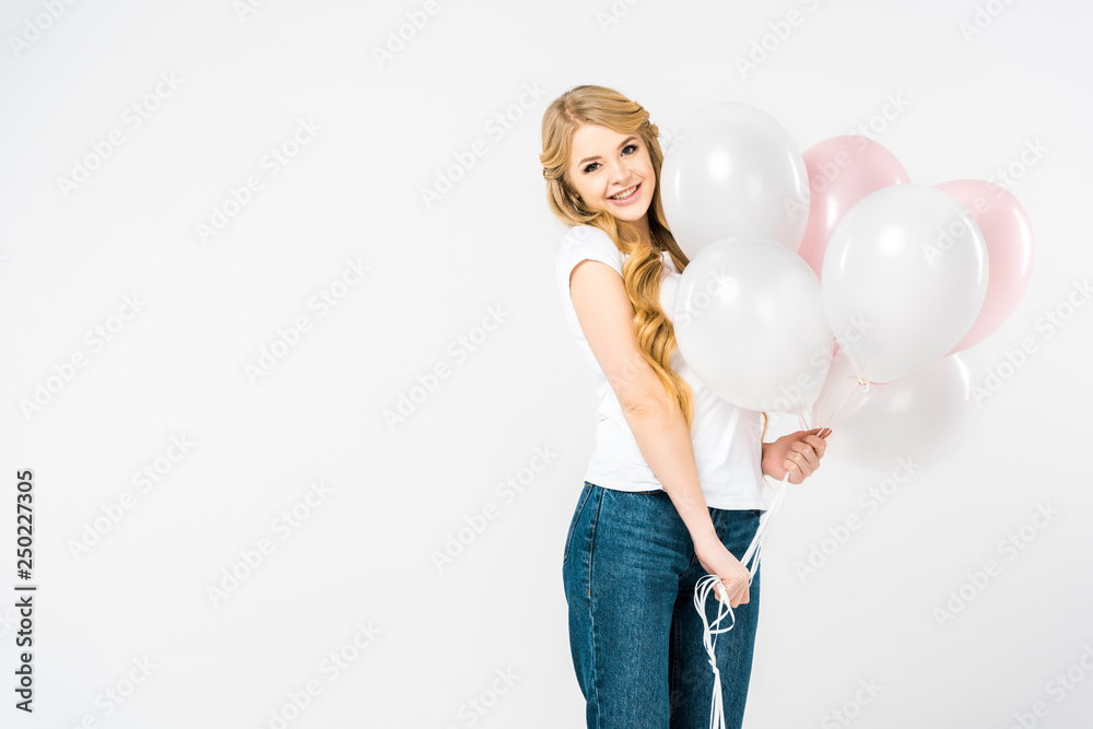 beautiful smiling woman holding air balloons and looking at camera on white background beautiful smiling woman holding air balloons and looking at camera on white background