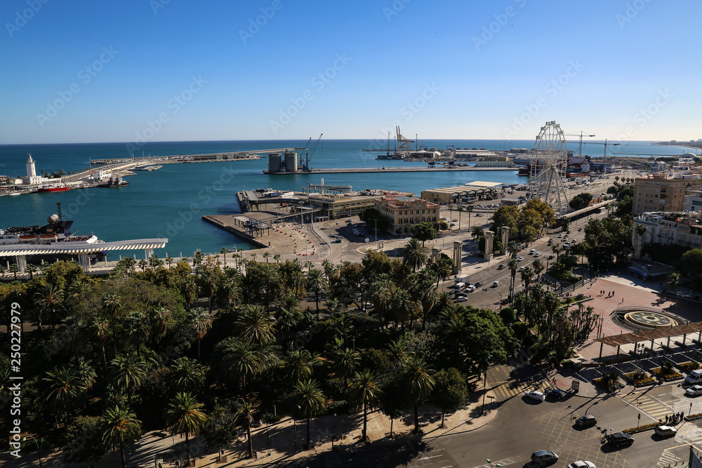 view of port of Málaga spain with tha big park in front and the clear sunny sky