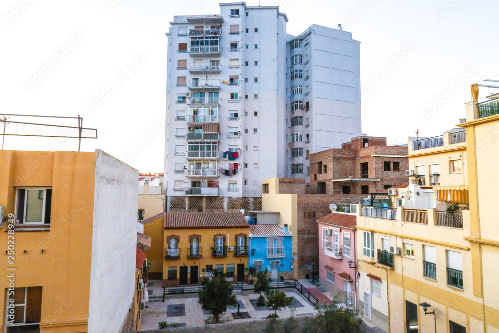 view of old colorful buildings and a white skyscraper view of old colorful buildings and a white skyscraper