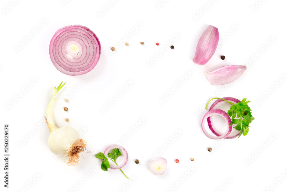 Red and white onions, shallots, parsley leaves and peppercorns, shot from the top forming a frame on a white background with a place for text Red and white onions, shallots, parsley leaves and peppercorns, shot from the top forming a frame on a white background with a place for text