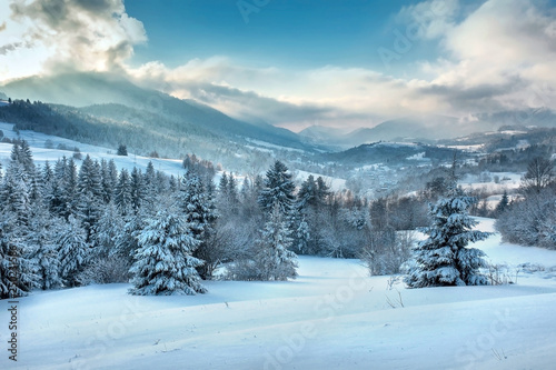Nice mountains view in snowy sunny day under blue sky with sun l © Andrii IURLOV