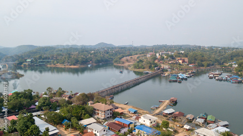 Auttamanusorn Wooden Bridge (Sapan Mon), Sungkaburi, Kanchanaburi, Thailand. Sangklaburi Sapan mon is most longer number two for wooden bridge in the world record. photo