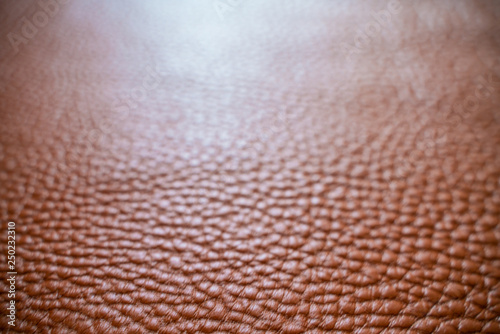 Tan brown leather selective focus close up with light