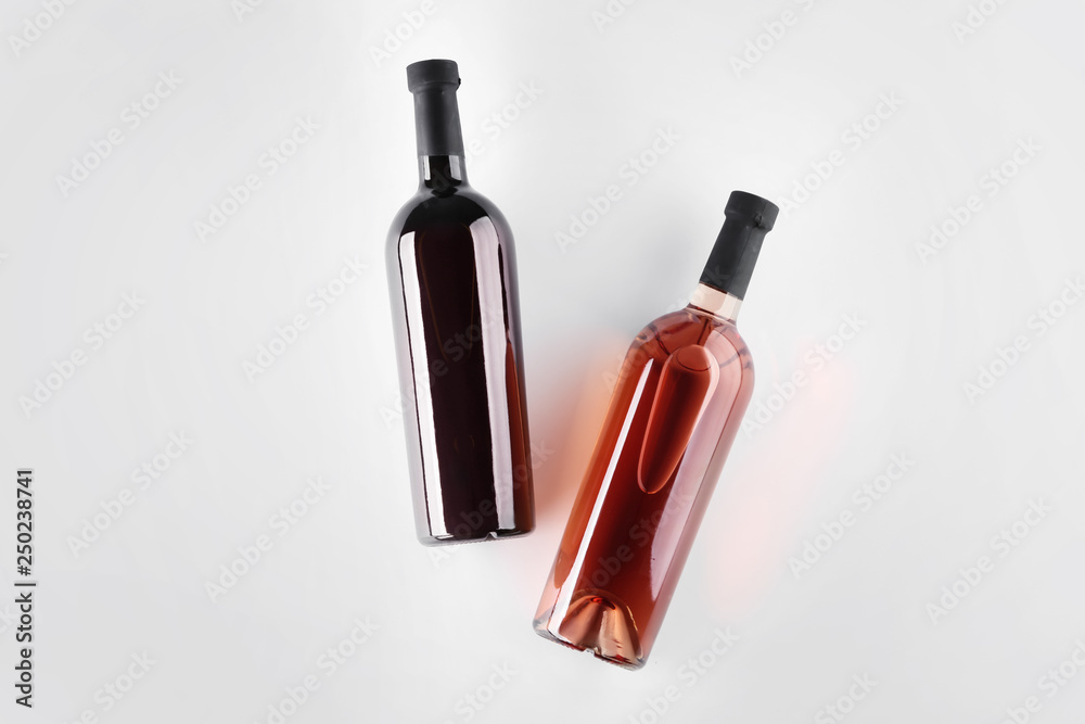 Bottles of tasty wine on light background Bottles of tasty wine on light background