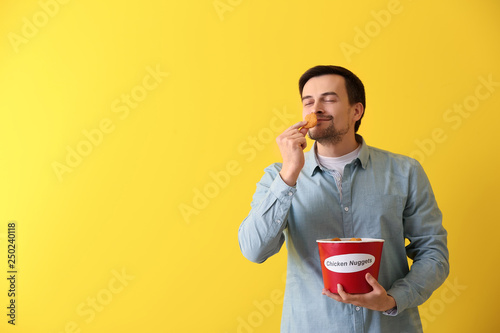 Handsome man with bucket of...