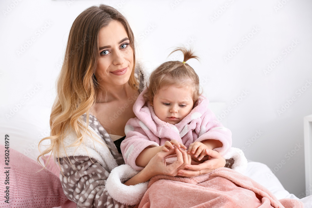 Young woman with her cute little daughter at home Young woman with her cute little daughter at home