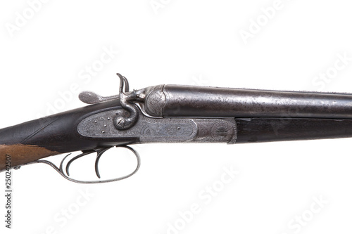 Vintage double-barreled hunting rifle isolated on a white back.