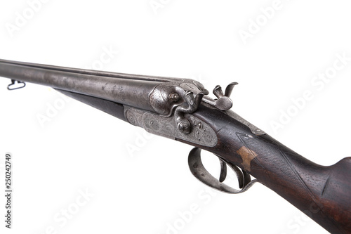 Vintage double-barreled hunting rifle isolated on a white back.