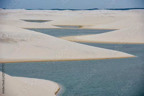 Fototapeta Naklejka Na Ścianę i Meble -  Lagoon on the middle of the dunes at Lencois Maranhenese National Park, Brazil