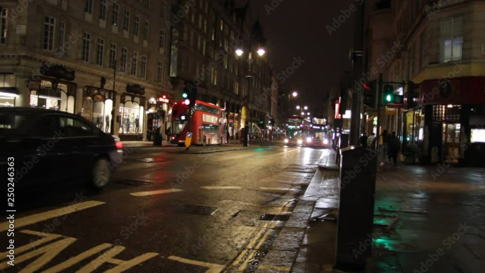 bus taxi phone box on the Strand road night London England . Tourism landmark vacation holiday London red London bus black taxi cab stock, footage, video, clip bus taxi phone box on the Strand road night London England . Tourism landmark vacation holiday London red London bus black taxi cab stock, footage, video, clip