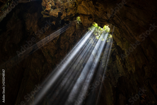 Sun rays coming from the cave ceiling hole, Marble Mountains, Da Nang, Vietnam