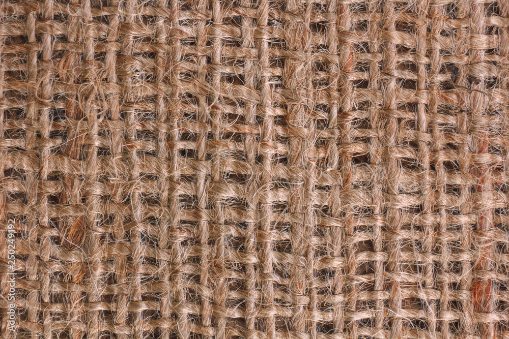 Closeup texture of burlap sack or sackcloth. Coarse-grained pattern of jute rope. Fabric background. Closeup texture of burlap sack or sackcloth. Coarse-grained pattern of jute rope. Fabric background.