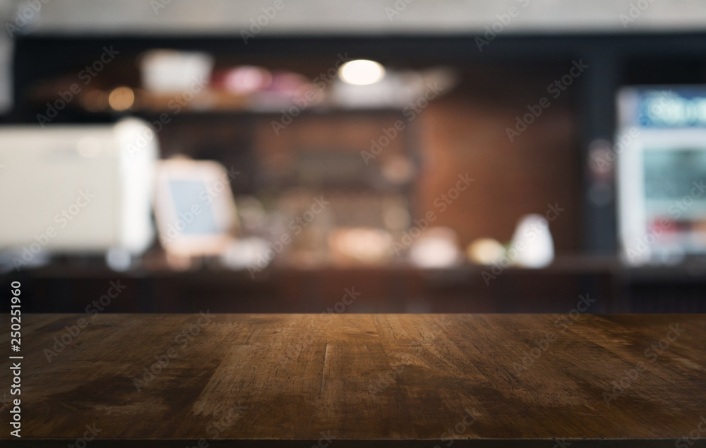 Empty dark wooden table in front of abstract blurred bokeh background of restaurant . can be used for display or montage your products.Mock up for space.