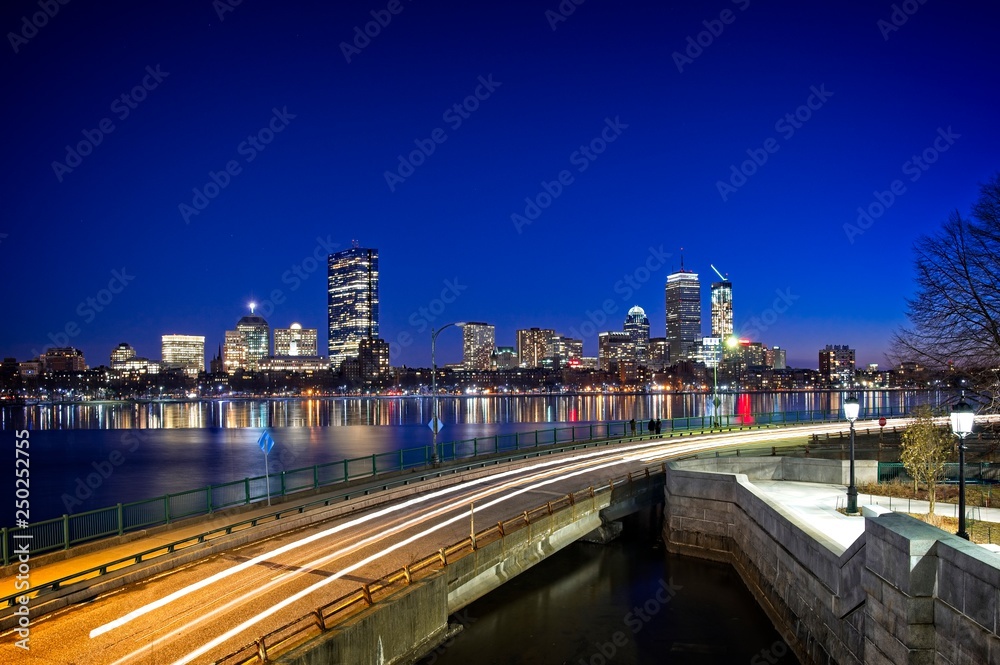 Long exposure of the Boston skyline from the Longfellow bridge on the Cambridge side. Overlooking the partially frozen Charles river with views of the Hancock building and Prudential center.