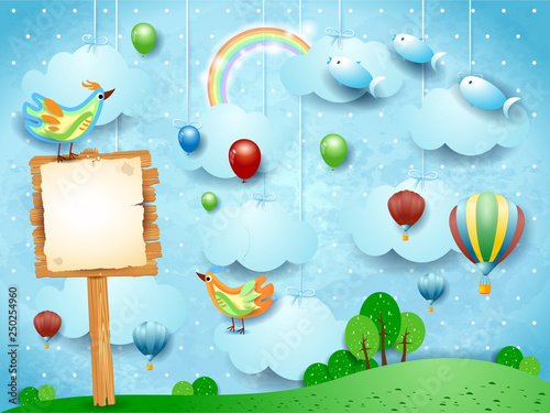 Fantasy landscape with balloons, birds, sign and flying fisches