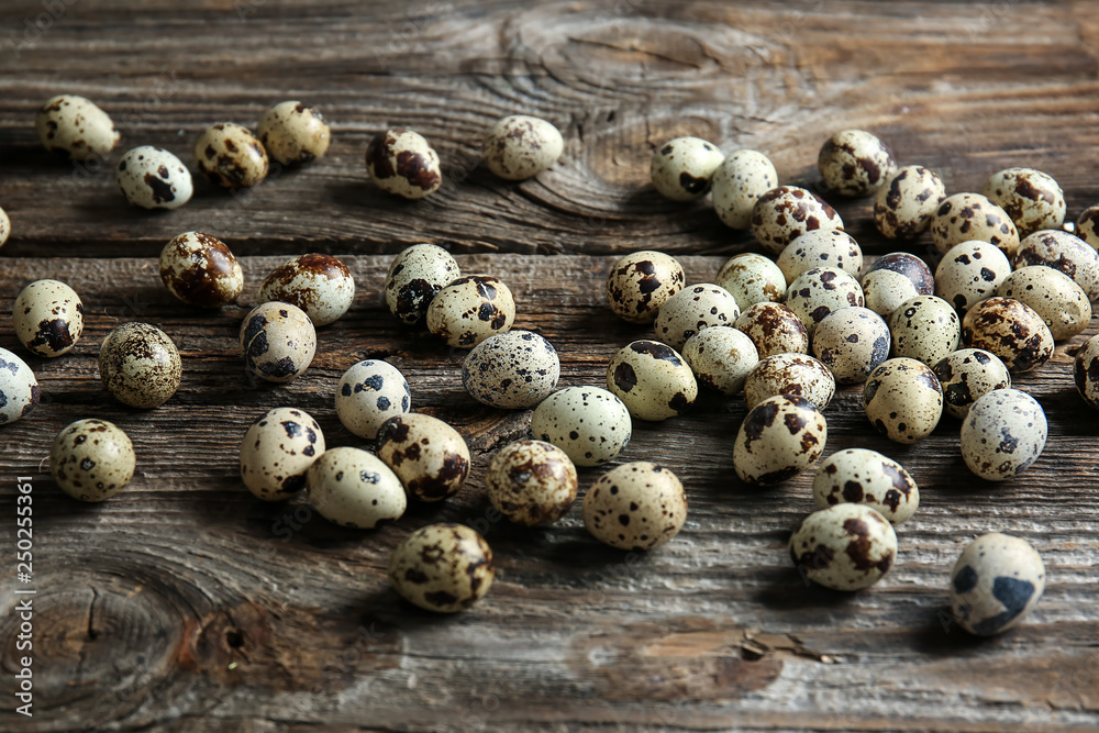 Many quail eggs on wooden table Many quail eggs on wooden table