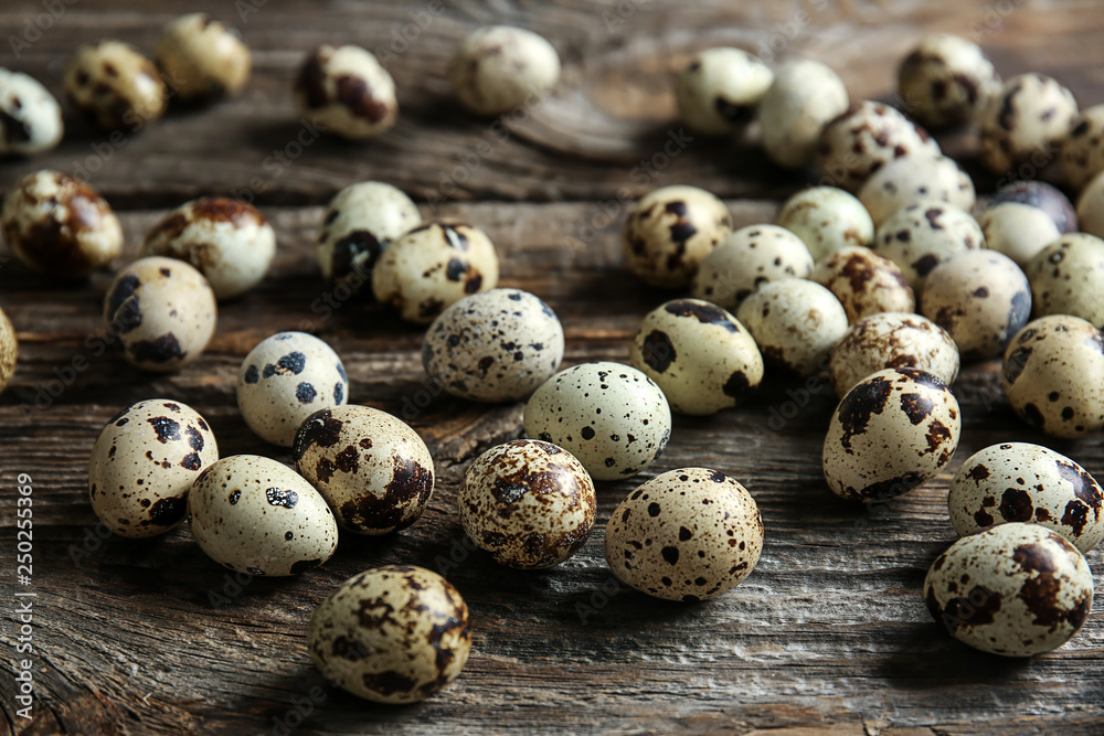 Many quail eggs on wooden table Many quail eggs on wooden table