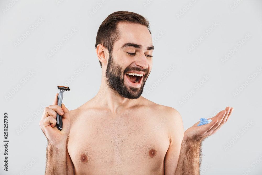 Fototapeta premium Portrait of a cheerful shirtless bearded man