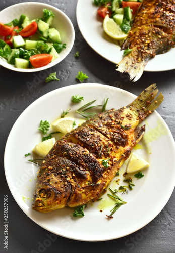 Grilled fish on plate
