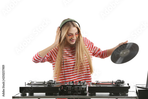 Female DJ playing music on white background