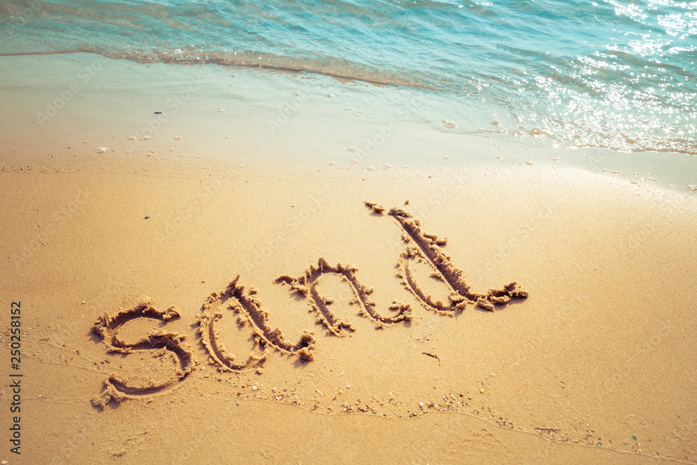 Vacation on the sand beach concept. Sand words written into the sand on the beach at Rayong, Thailand Vacation on the sand beach concept. Sand words written into the sand on the beach at Rayong, Thailand