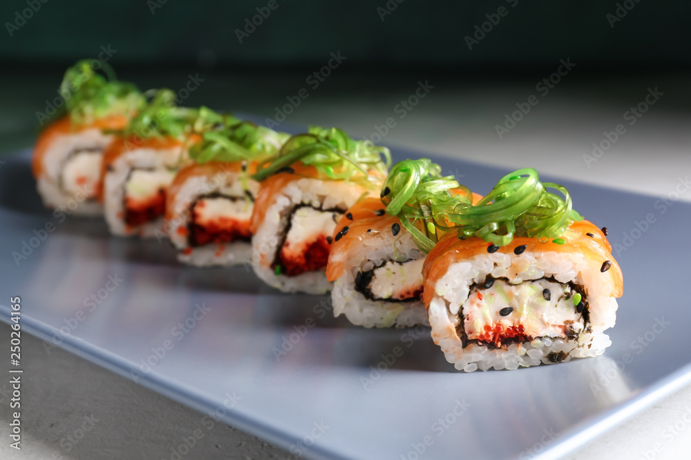 Tasty sushi rolls on plate, closeup Tasty sushi rolls on plate, closeup