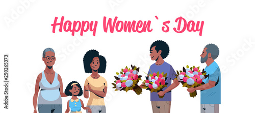happy multi generation family congratulating women with international 8 march day concept men giving flowers african american characters portrait horizontal greeting card