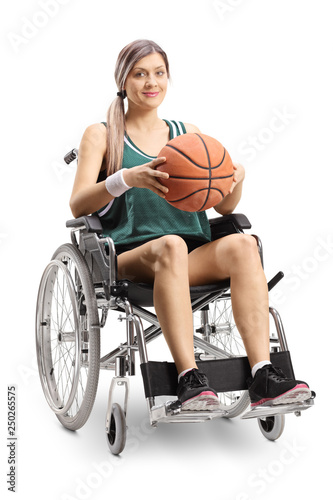 Woman in a wheelchair holding a basketball
