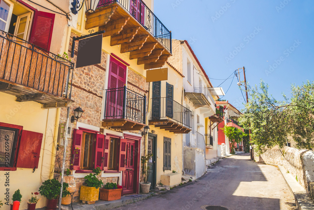 Fototapeta premium Traditional cozy greek street in city Nafplio, Greece