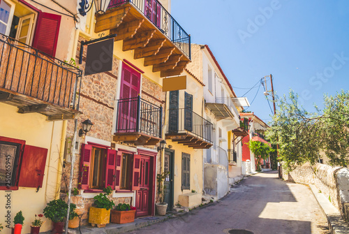 Traditional cozy greek street in city Nafplio, Greece photo