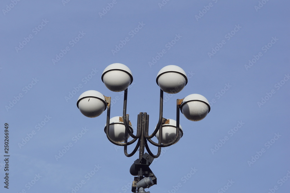 old street lamp on blue sky