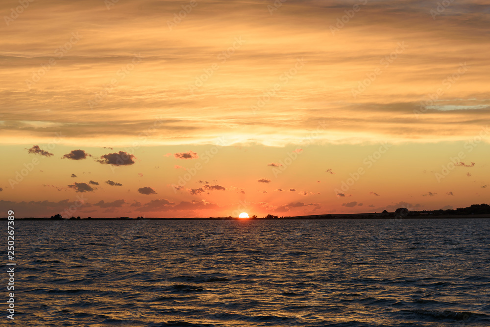 The setting sun on the estuary. The setting sun on the estuary.