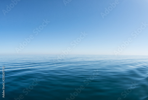 Blue sea with waves and clear blue sky
