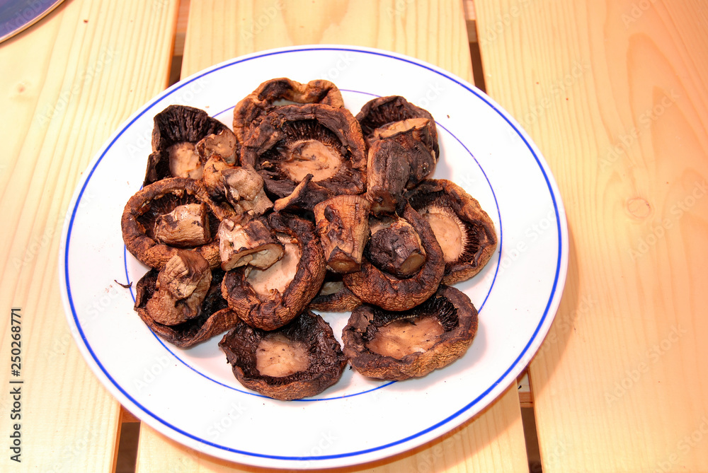 Grilled mushrooms on a white plate