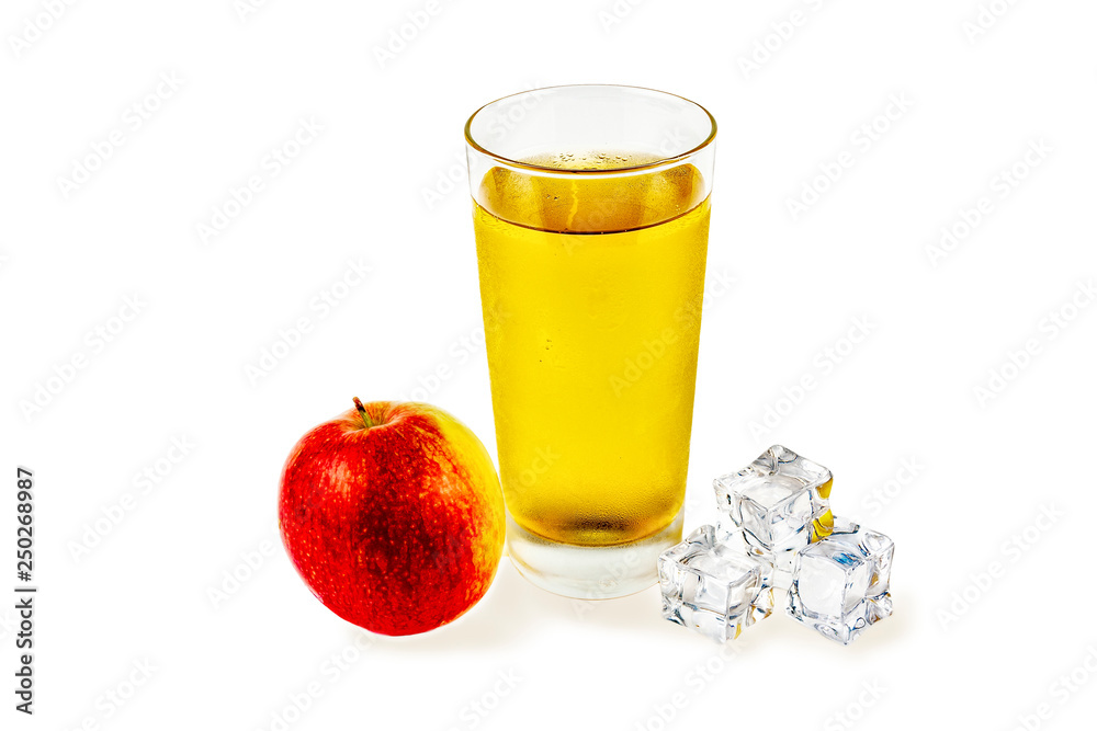 Close-up on a white background, a glass with apple juice, ice cubes and an apple Close-up on a white background, a glass with apple juice, ice cubes and an apple