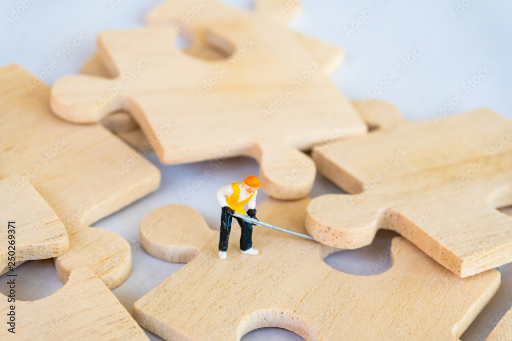 Technician concept sit on the jigsaw puzzle meaning of key success