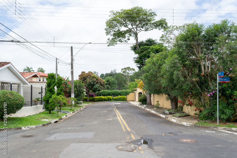 Typical street view of the nice city of Atibaia, Sao Paulo, Brazil. Every street is full of colorful greenery and natural features which provide good shadows and sun repair