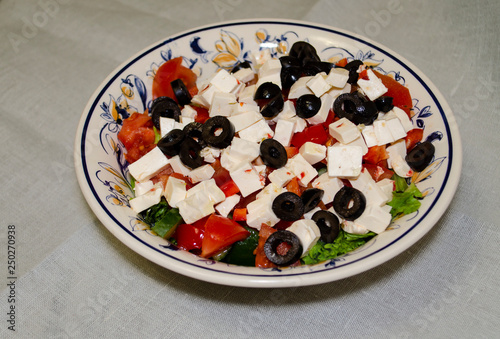 Greek salad with fresh vegetables, feta cheese and black olives
