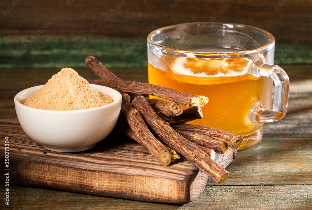 Licorice cup of tea, powder and roots Glycyrrhiza glabra. Top view