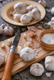 Composition with fresh garlic on wooden table