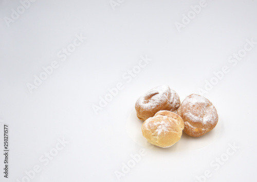 Isolated pastry with cream and sugar dust