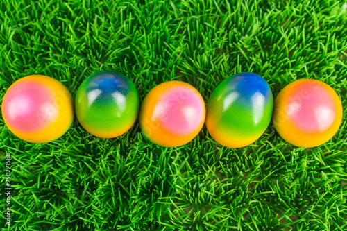 Colorful Easter eggs in the meadow