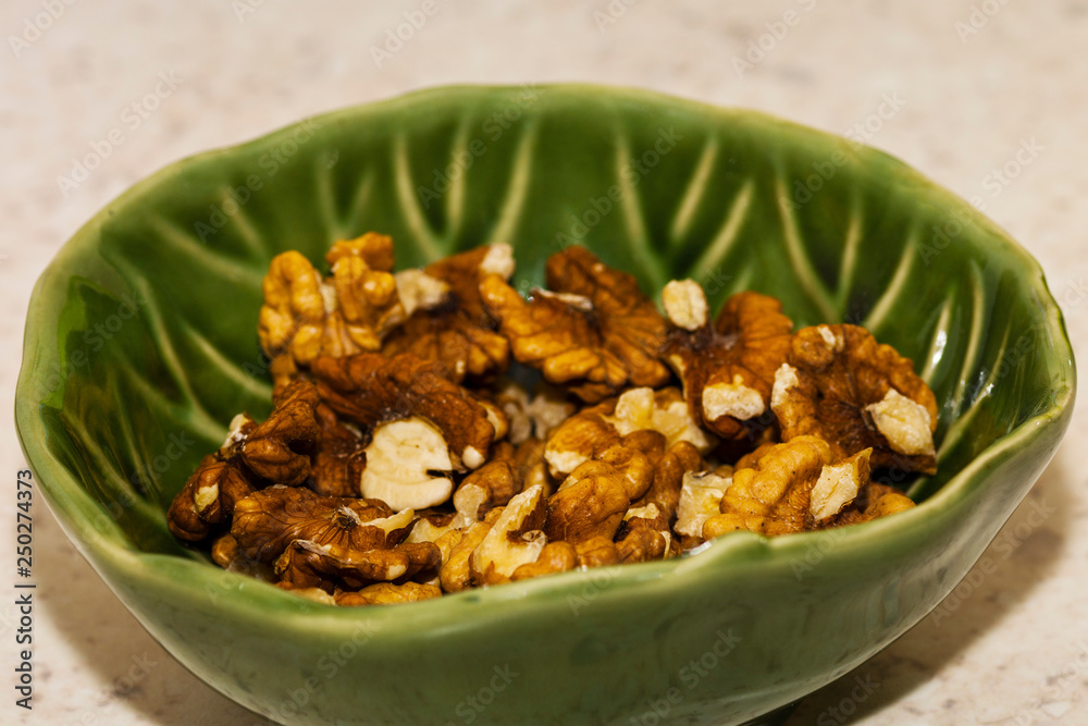 Shelled pecans in beautiful textured bowl