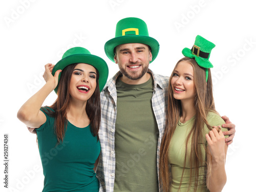 Young people in green hats on white background. St. Patrick's Day celebration