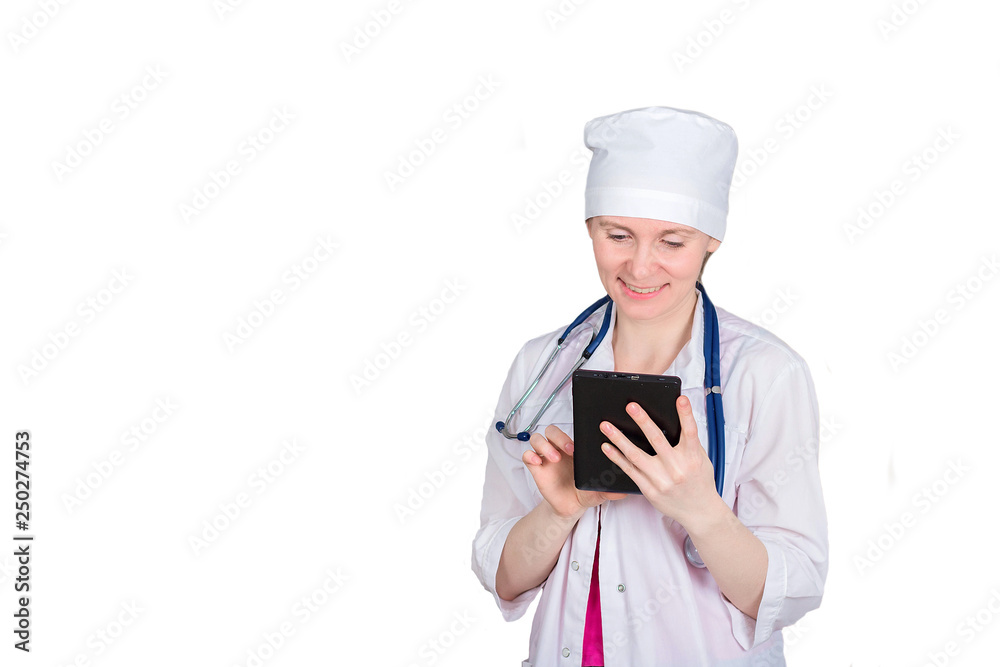 Female doctor or nurse with a stethoscope uses a tablet. Isolated on white background, copyspace. Female doctor or nurse with a stethoscope uses a tablet. Isolated on white background, copyspace.