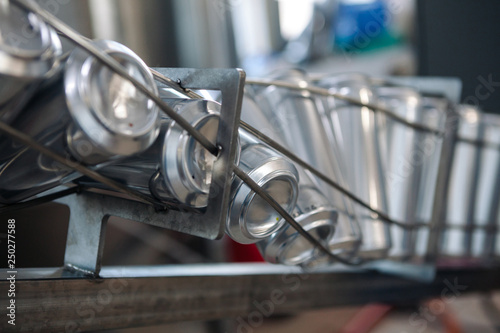 Conveyor for bottling beer in aluminum cans. Close up