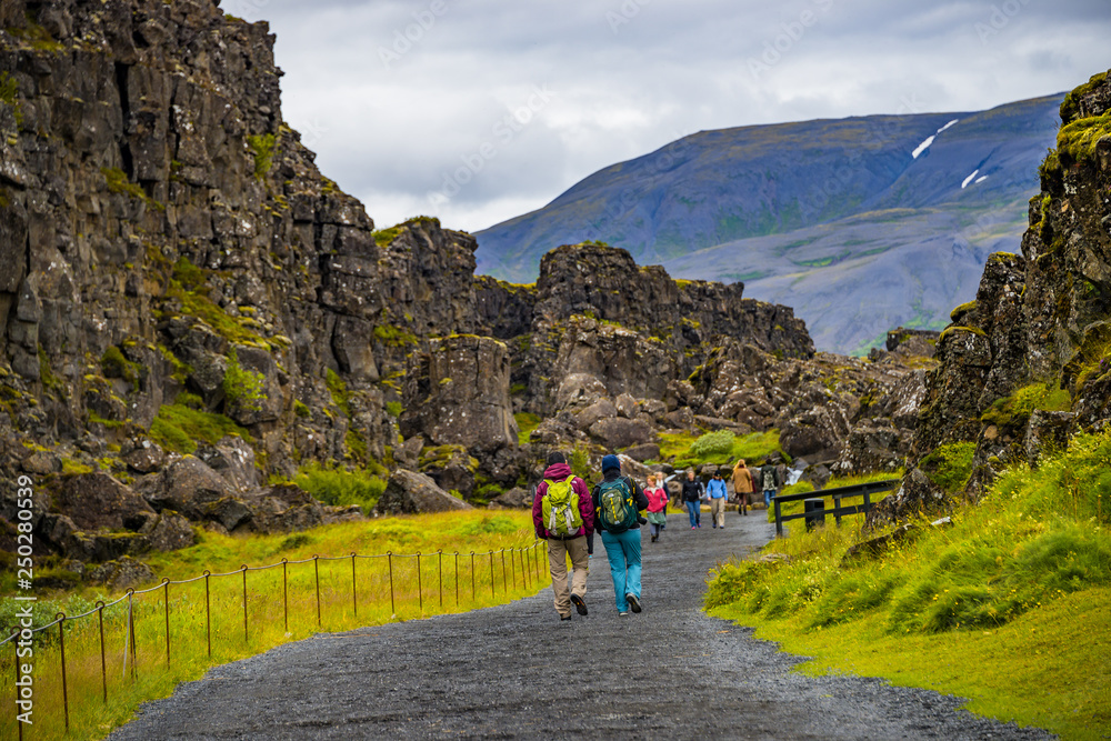 Thingvellir national park, Pingvallavatn huge tectonic plates drifting cracks and tourists on Iceland, summer time