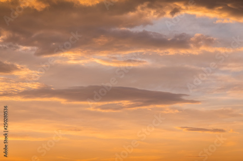 Abstract nature background. Dramatic and moody yellow cloudy sunset sky © Kennymax